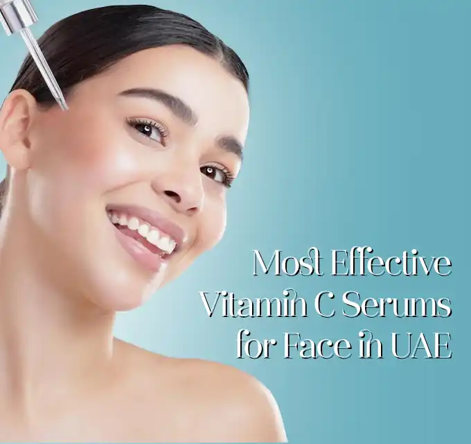 Model applying vitamin C serum to the cheek from a dropper against a teal background most effective vitamin C serum for face to boost collagen, reduce hyperpigmentation and improve skin texture